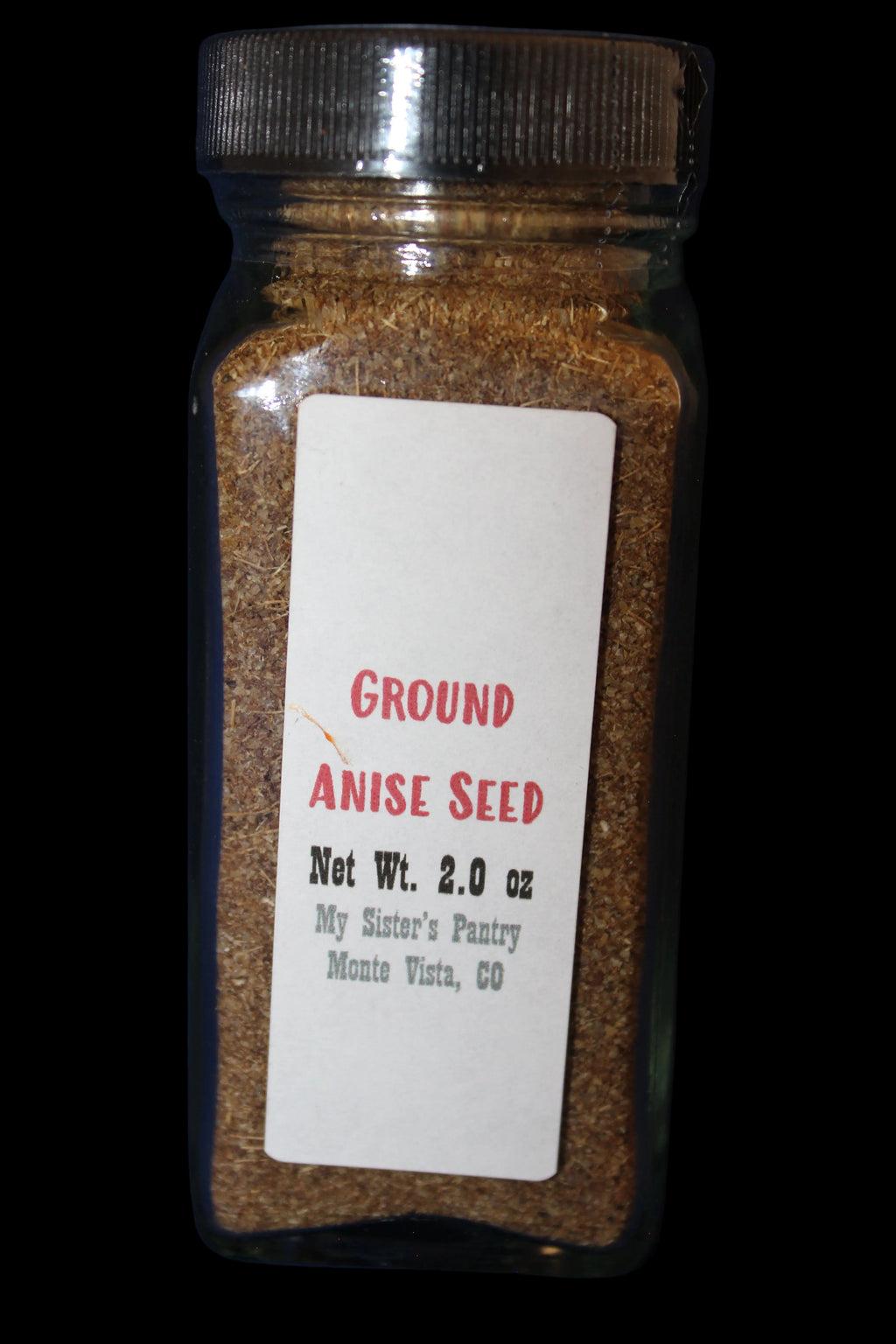 Jar of ground anise seed with a label