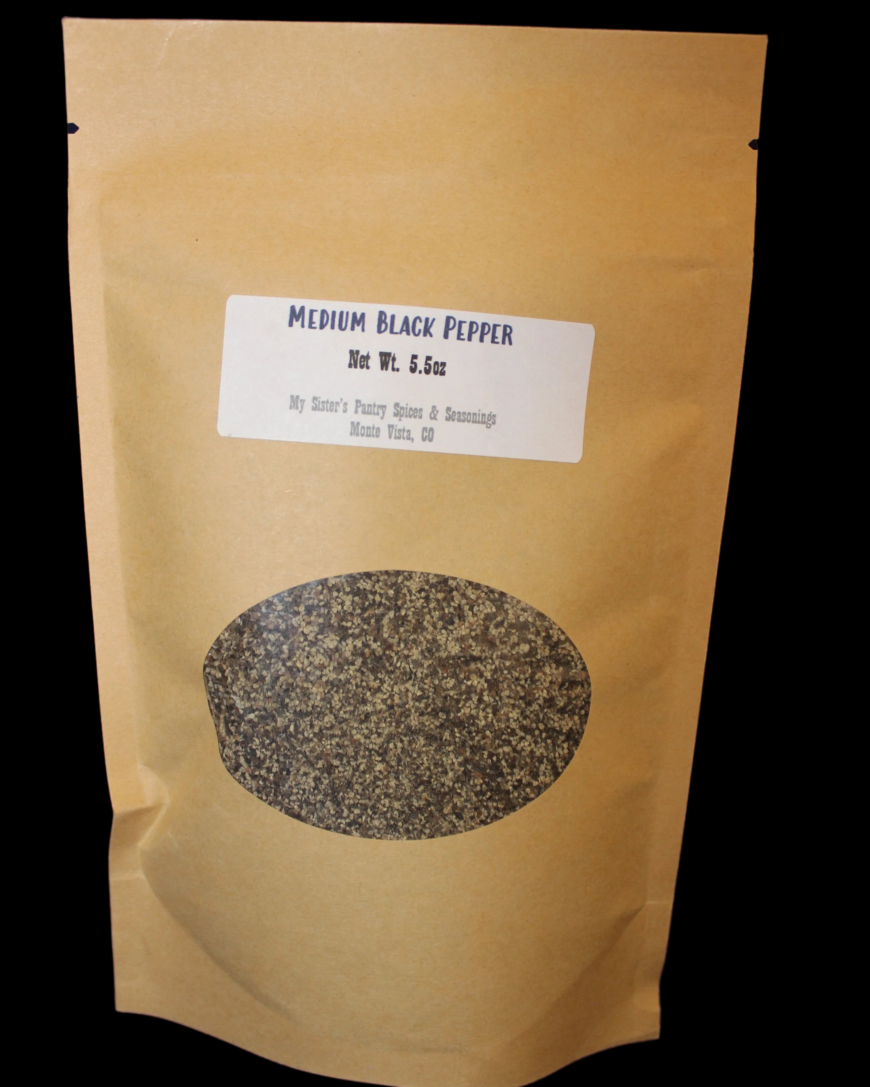 Brown paper package with black pepper and label