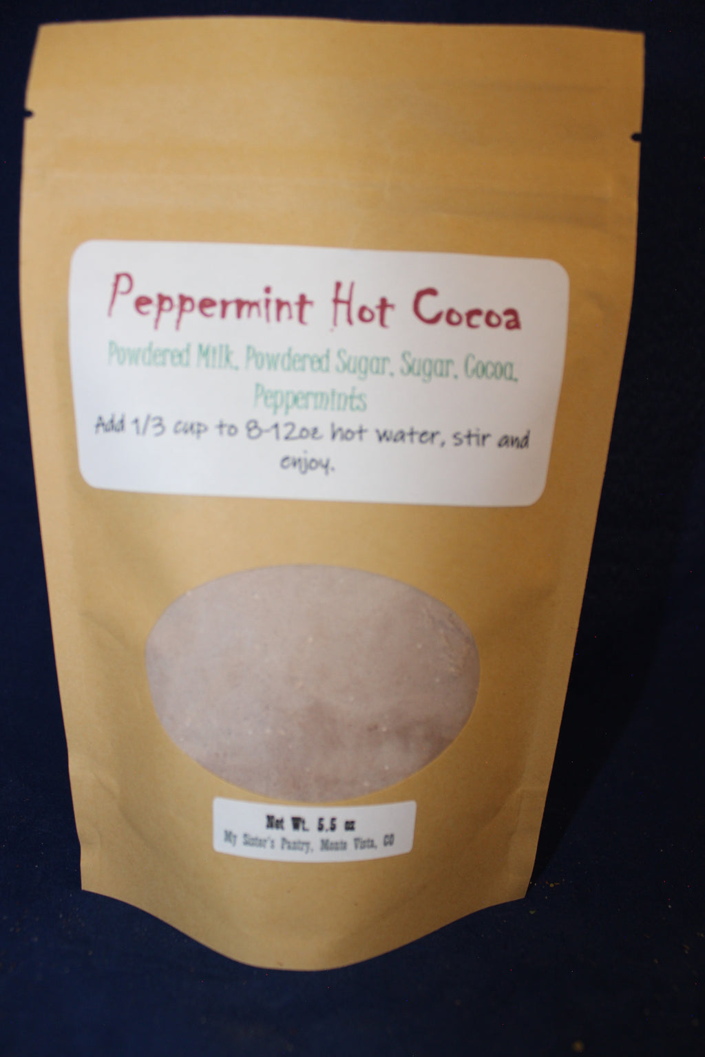 package of peppermint hot cocoa with a label on a dark background