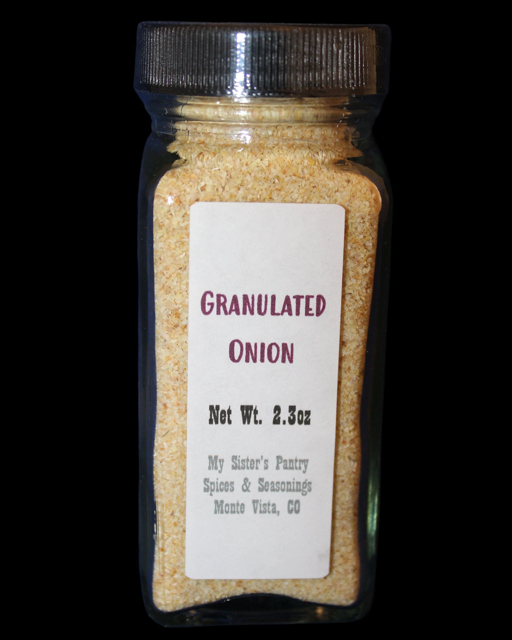 Jar of granulated onion powder with a label