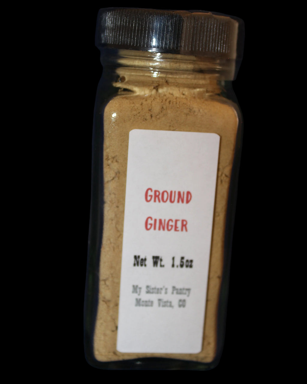 Bottle of ground ginger with a label 