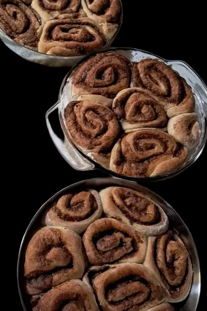 Three pans of cinnamon rolls