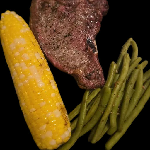 Steak, corn on the cob, and green beans 