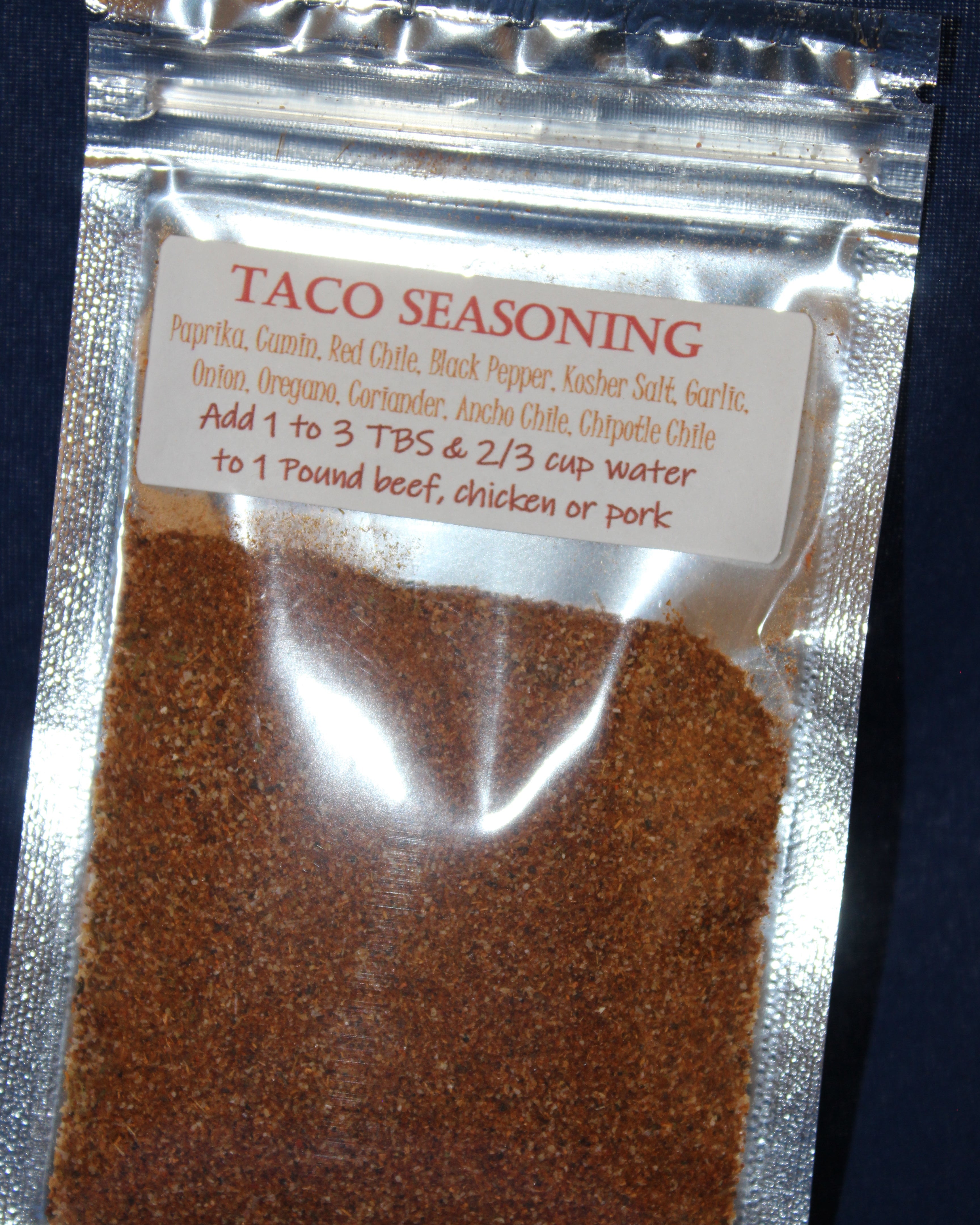 Taco seasoning packet with visible text on a dark background