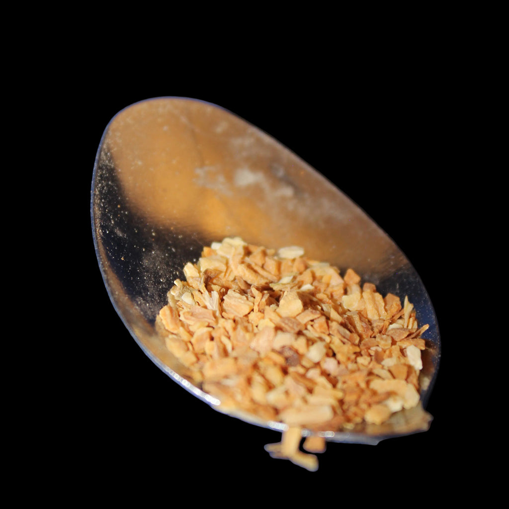 Spoon with toasted minced onion